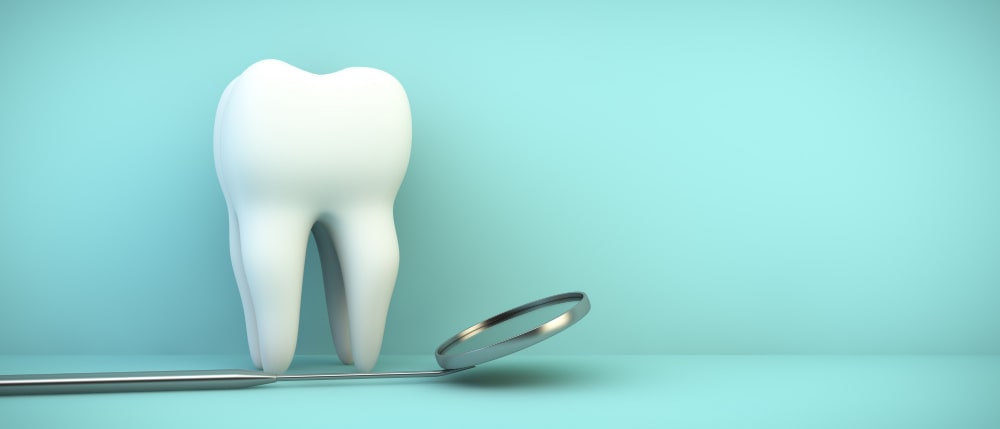 Grafika przedstawiająca ząb i lusterko dentystyczne